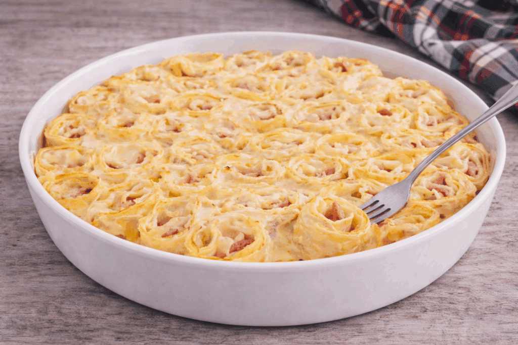 Avevo voglia di lasagna ma non di fare la solita teglia: così ho fatto queste girelle filanti, cremose dentro e gratinate sopra!